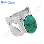 Load image into Gallery viewer, Sterling silver ring with a large oval-shaped turquoise gemstone, vibrant teal color.