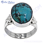 Load image into Gallery viewer, Sterling silver ring with a large, round turquoise gemstone. Features a polished silver band with intricate detailing on each side of the stone.