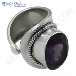 将图像加载到图库查看器中, Sterling silver ring with a large, oval-cut amethyst gemstone. The purple stone is set in a polished silver band.