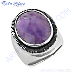 Load image into Gallery viewer, Sterling silver ring with a large, oval-cut amethyst gemstone. The ring features an intricate design.