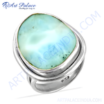 Load image into Gallery viewer, Sterling silver ring featuring a large, oval-shaped blue and white Larimar gemstone, set in a modern design.