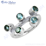 Load image into Gallery viewer, Sterling silver ring featuring multiple round blue topaz gemstones, set in a unique modern design.