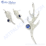 Load image into Gallery viewer, Sterling silver earrings and pendant set featuring blue sapphire gemstones in a unique claw design.