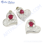 Load image into Gallery viewer, Silver heart-shaped stud earrings with a central red ruby gemstone, perfect for women's jewelry.