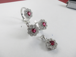将图像加载到图库查看器中, 925 sterling silver jewelry set featuring ruby-colored gemstones in a flower design: ring, earrings, and pendant.