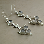 Load image into Gallery viewer, Sterling silver dangle earrings with multiple gemstones on a neutral background.