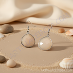 Load image into Gallery viewer, Silver teardrop dangle earrings with a faceted beige gemstone.
