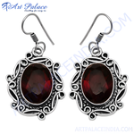 Load image into Gallery viewer, 925 sterling silver drop earrings with oval red garnet gemstones.