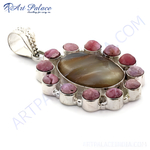 Load image into Gallery viewer, Sterling silver pendant featuring a large brown gemstone center surrounded by pink gemstones.
