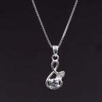 Load image into Gallery viewer, Sterling Silver Infinity Knot Pendant Necklace with Clear Cubic Zirconia