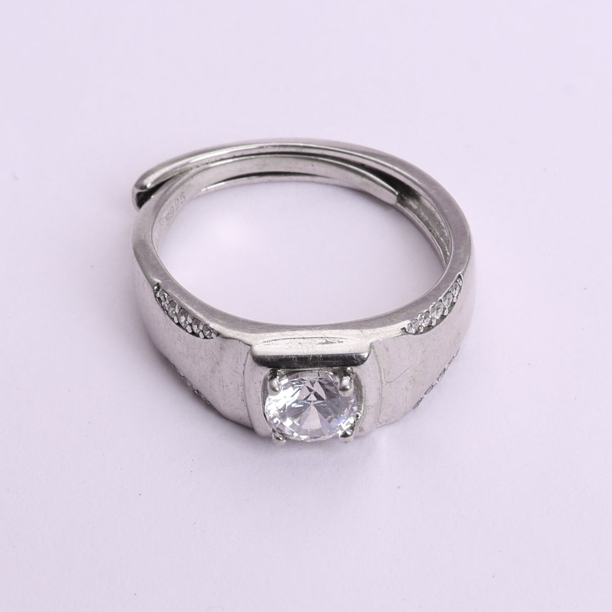 Sterling silver men's band ring with solitaire and accent diamonds