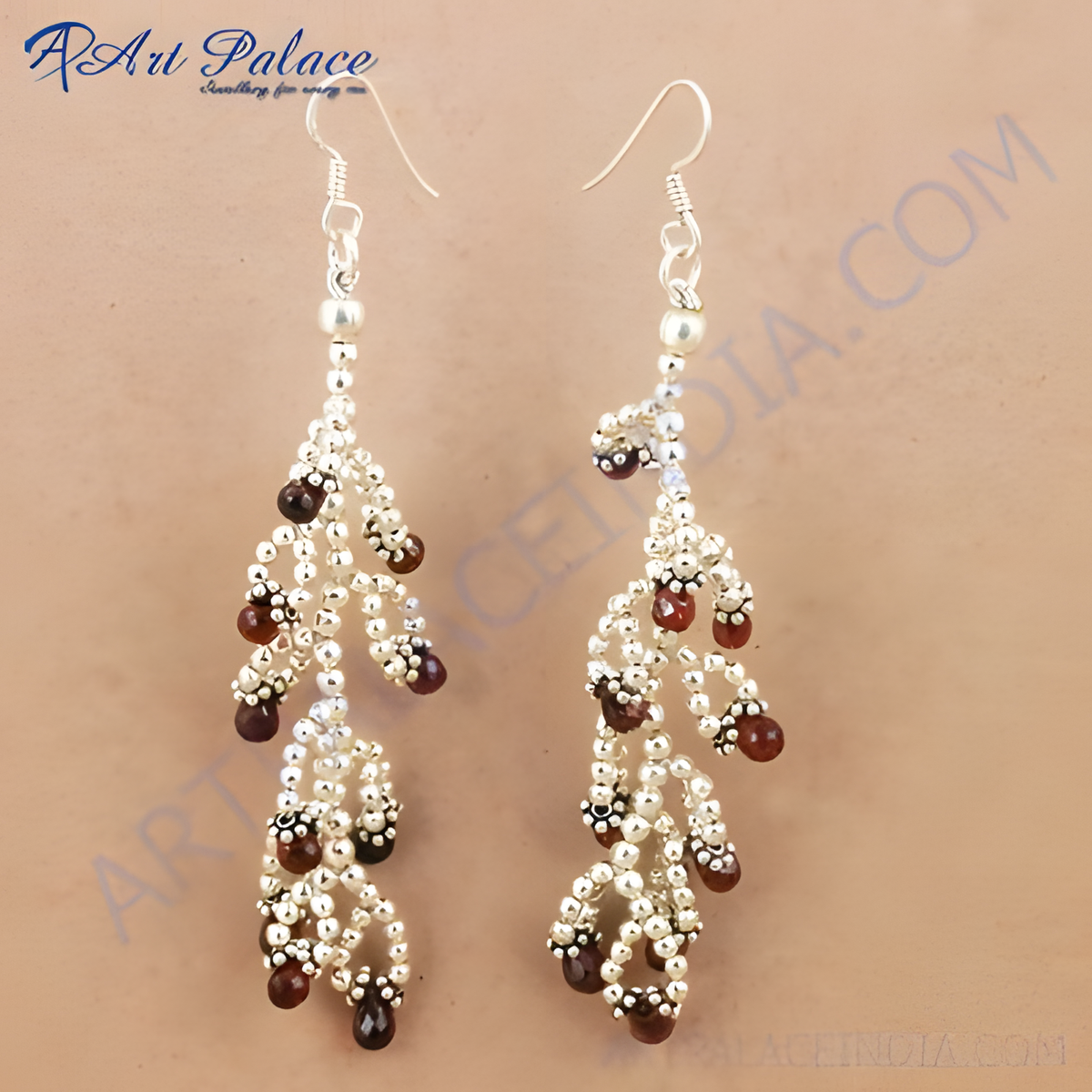 925 sterling silver drop earrings with beaded design and deep red garnet gemstones