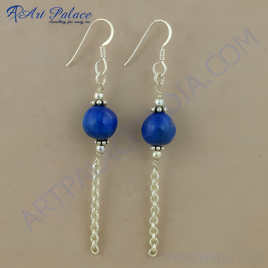 Sterling silver dangle earrings with blue gemstone and chain accents, perfect for women's jewelry.