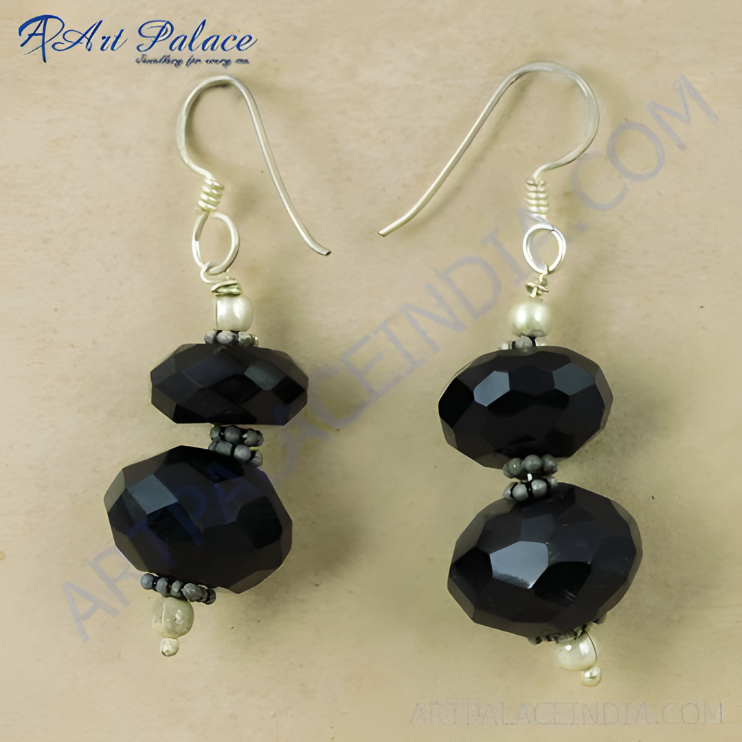Black onyx drop earrings with faceted beads and silver accents, a striking jewelry piece for women.