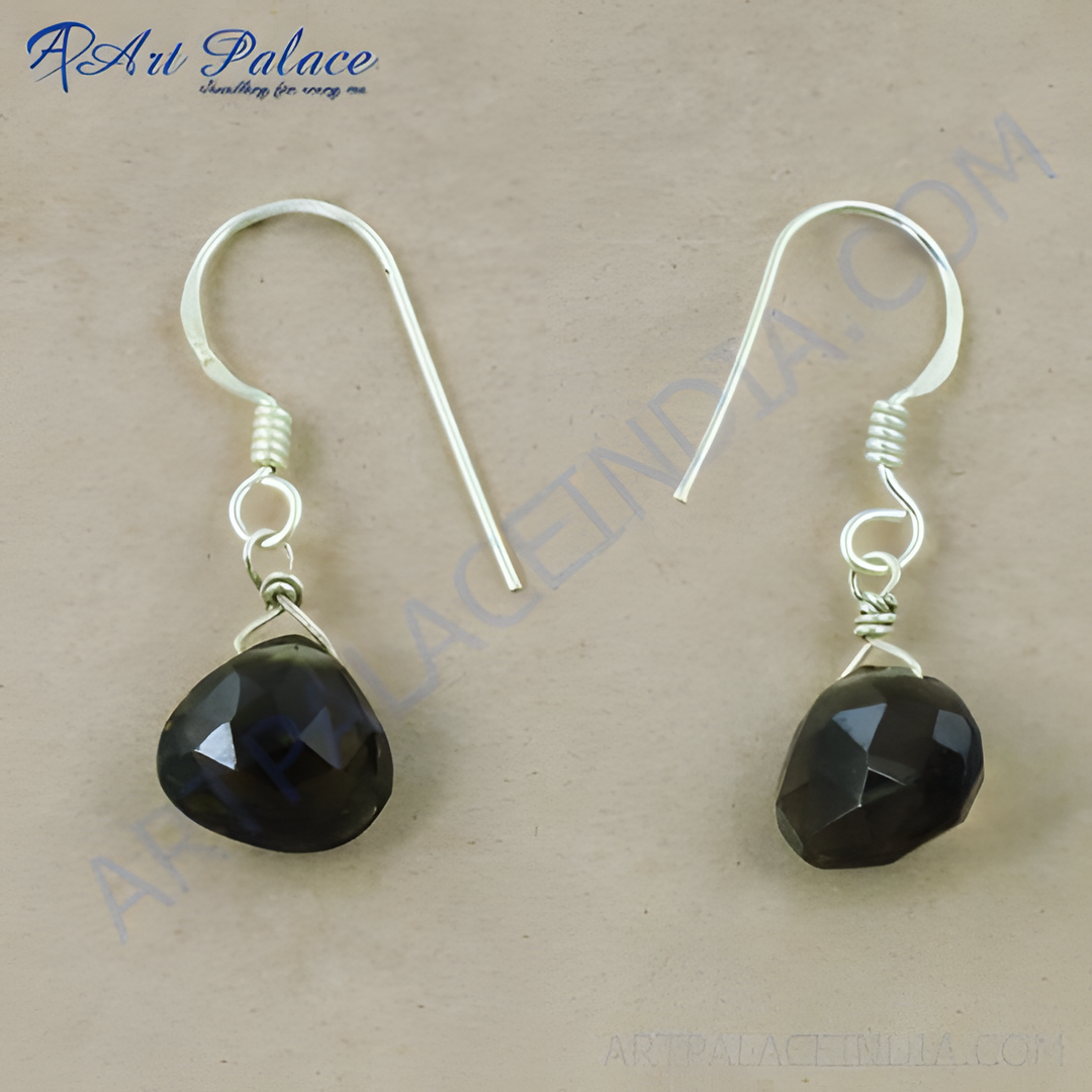 Sterling silver dangle earrings with faceted black onyx teardrop gemstones.