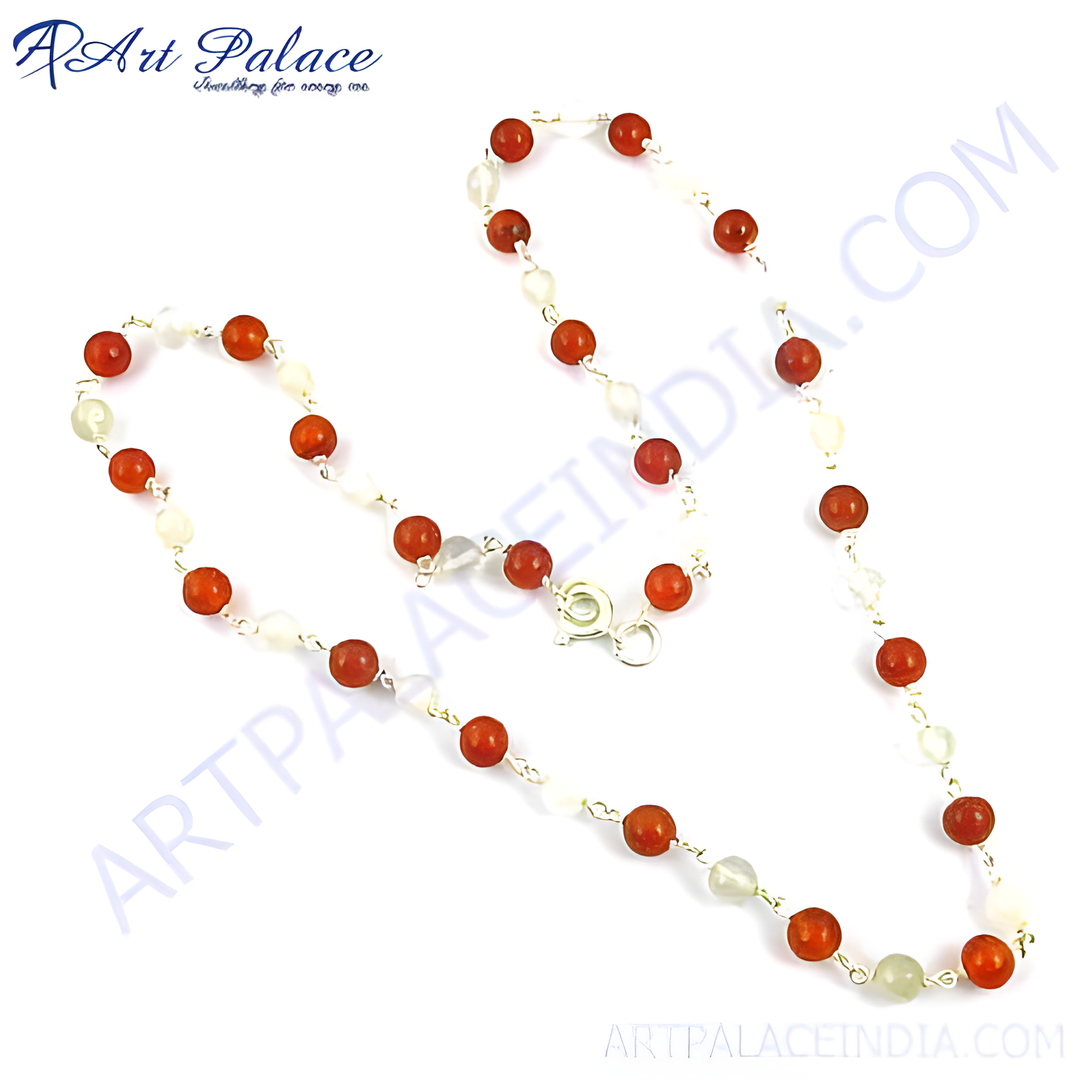 Red carnelian and pearl beaded necklace with silver chain, showcasing a combination of red and white gemstones.