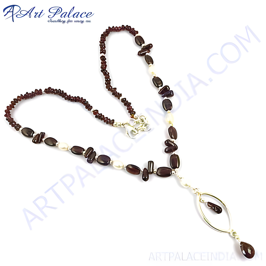 Garnet and pearl pendant necklace with silver accents on a white background, elegant jewelry for women.