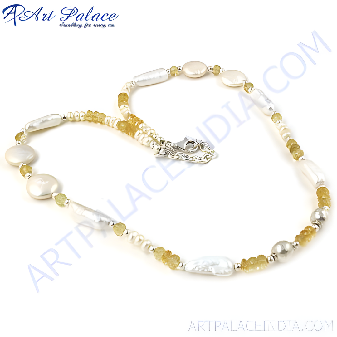 Sterling silver necklace featuring freshwater pearls and citrine gemstones in a delicate design.