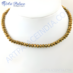 Load image into Gallery viewer, Gold beaded necklace displayed on a mannequin, faceted beads, gold color jewelry
