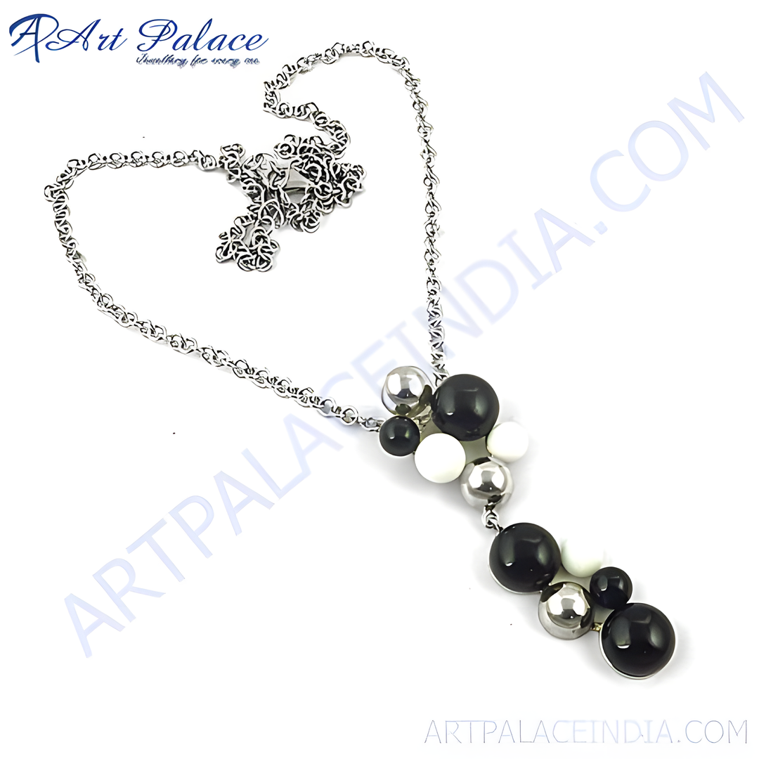 Silver pendant necklace with black, white, and silver beads. Fashion jewelry for women.