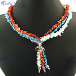 Load image into Gallery viewer, Multi-stone beaded necklace with red, blue, and white gemstones on a black mannequin
