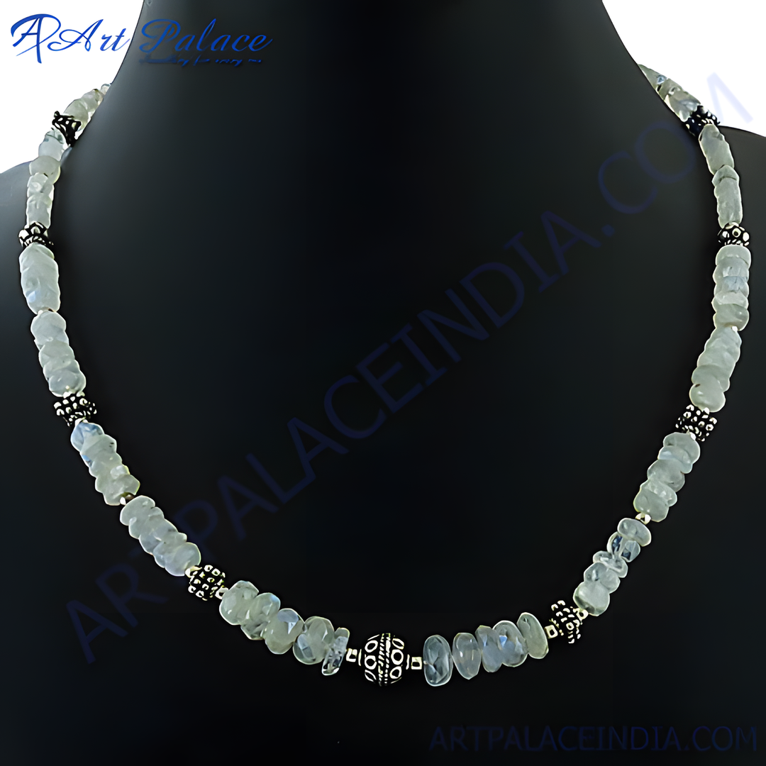 Moonstone bead necklace with silver accents displayed on a black background, a beautiful piece of gemstone jewelry