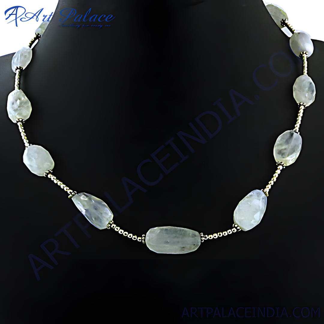 Moonstone bead necklace on a black background. Features irregular moonstone beads and gold-toned accents.