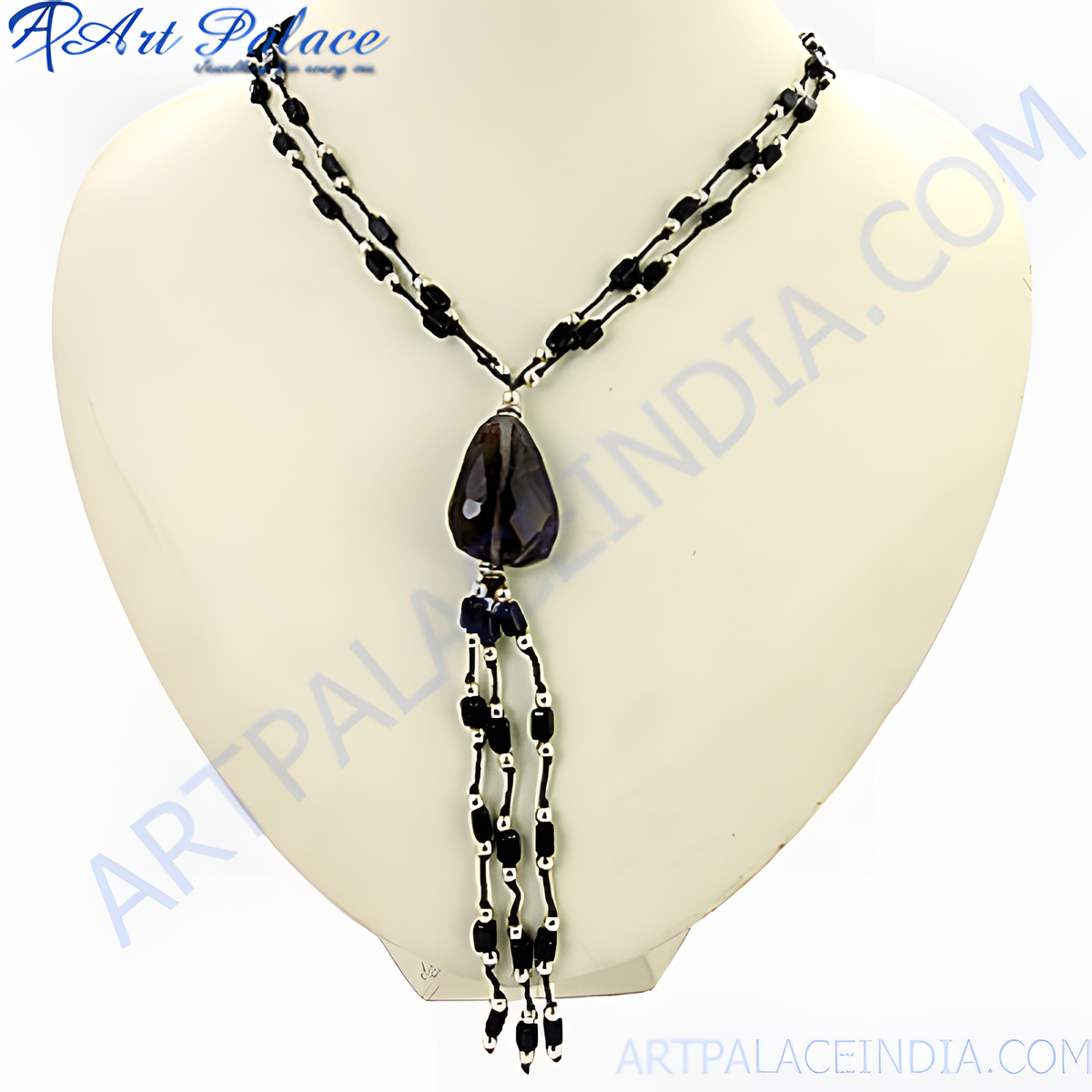 Black onyx beaded y necklace with teardrop gemstone pendant on a white mannequin