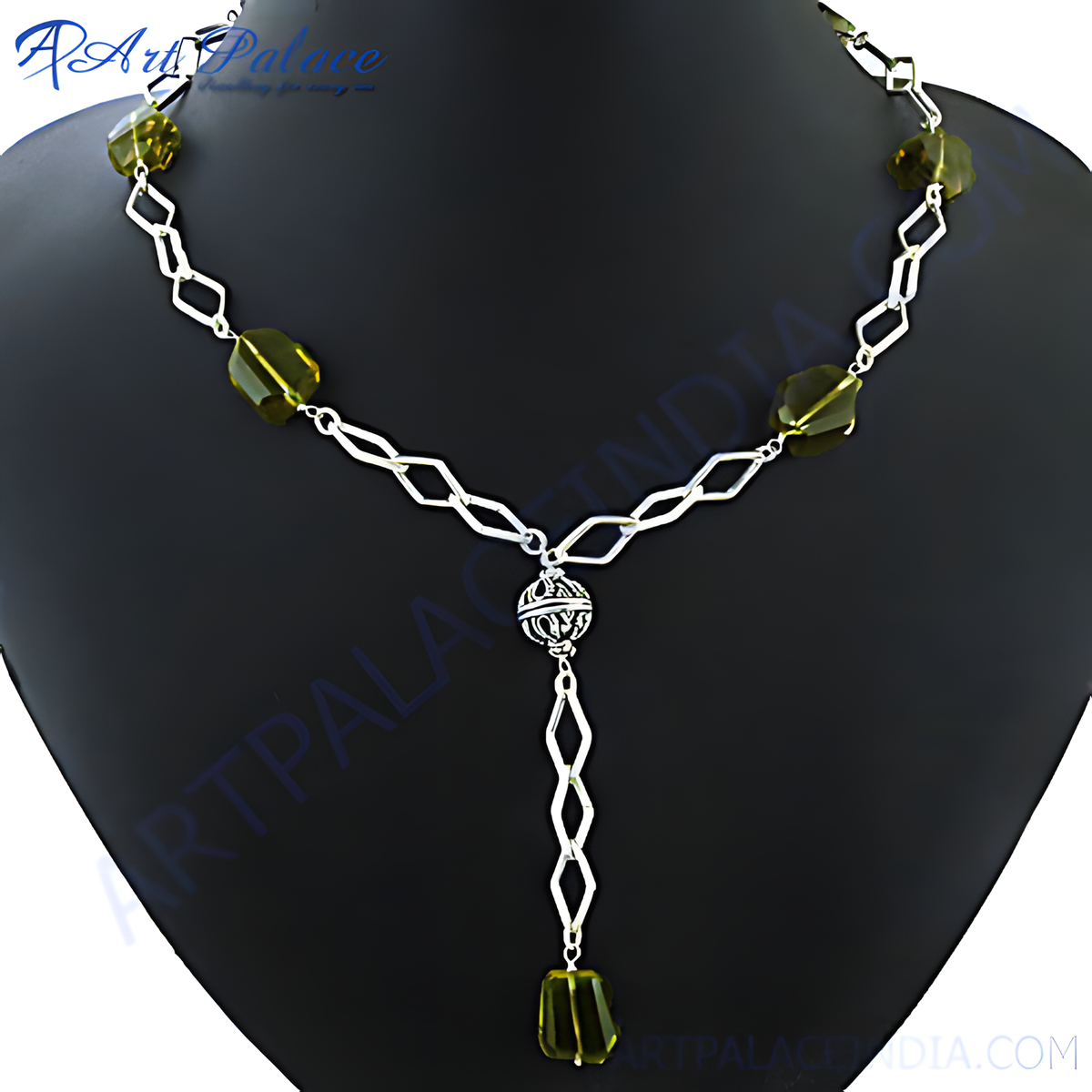Silver chain necklace with geometric links and green gemstones, perfect for a modern and stylish look