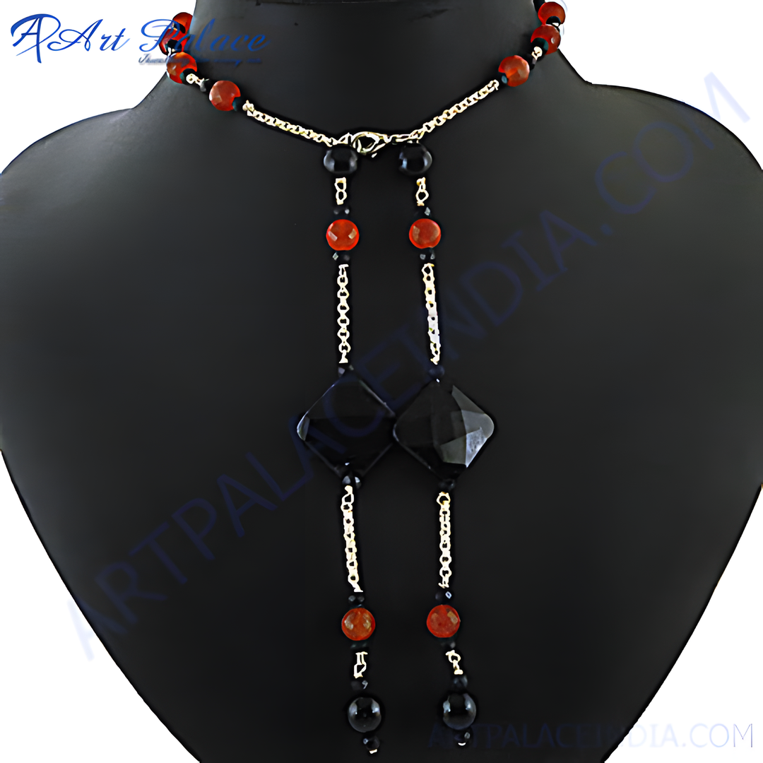 Black onyx and red agate lariat necklace displayed on a mannequin, showcasing the unique gemstone design.