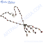 Load image into Gallery viewer, Garnet beaded necklace with a unique design, showcasing red gemstones on a black cord.
