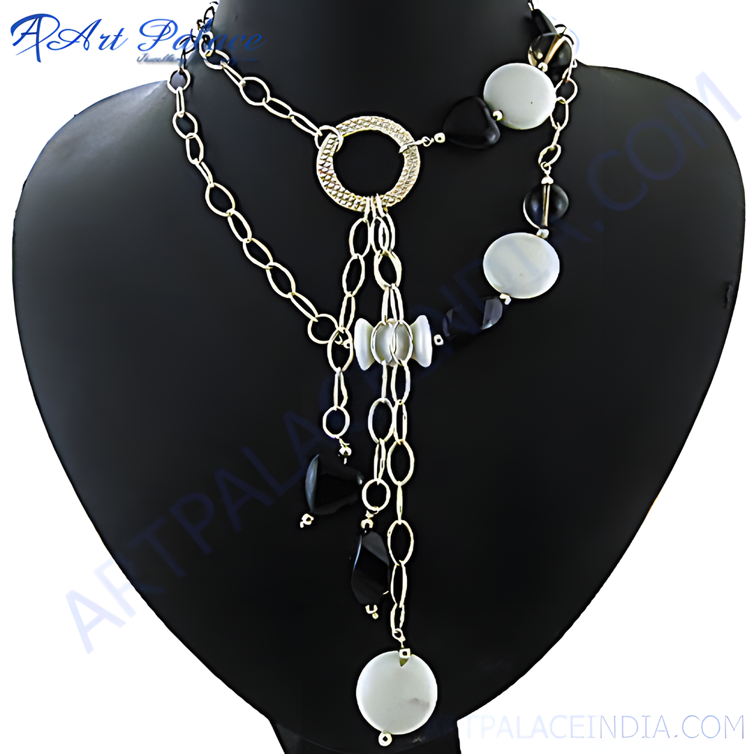 Gold chain necklace with black and white stones displayed on a black mannequin, perfect for women