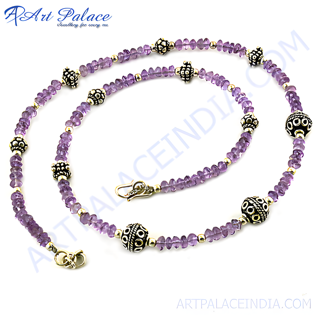 Amethyst bead necklace with silver accents, purple gemstone and sterling silver design.