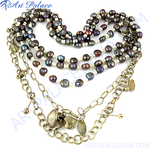 Load image into Gallery viewer, Multi-strand necklace with dark pearls and a gold chain.
