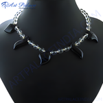 Load image into Gallery viewer, Black onyx and clear quartz statement necklace on a black jewelry display
