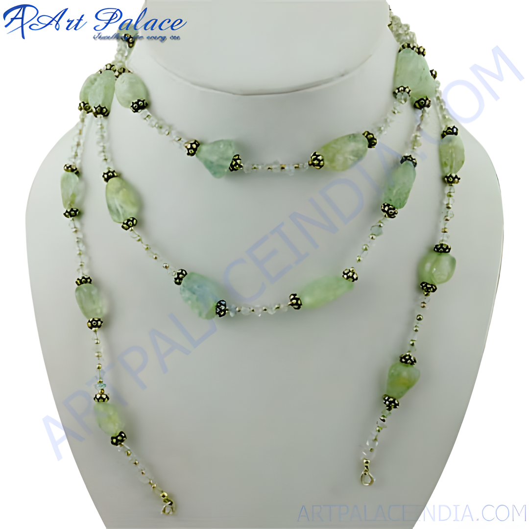Layered green gemstone beaded necklace on a white mannequin. Elegant and stylish.