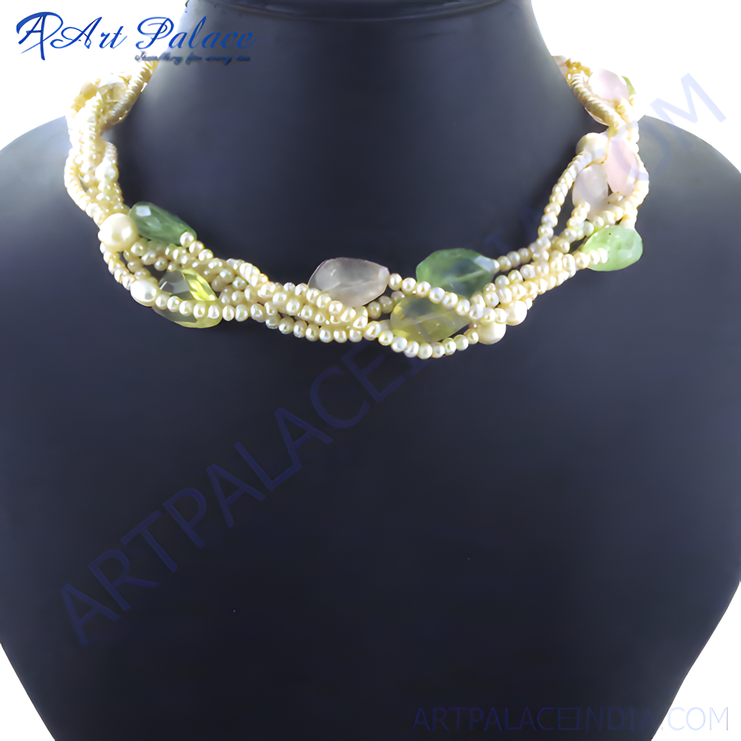 Braided necklace with pearls and green, and pink gemstones on a black background. Fashion statement necklace.