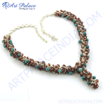 Load image into Gallery viewer, Turquoise and garnet beaded necklace with sterling silver chain on a white background.
