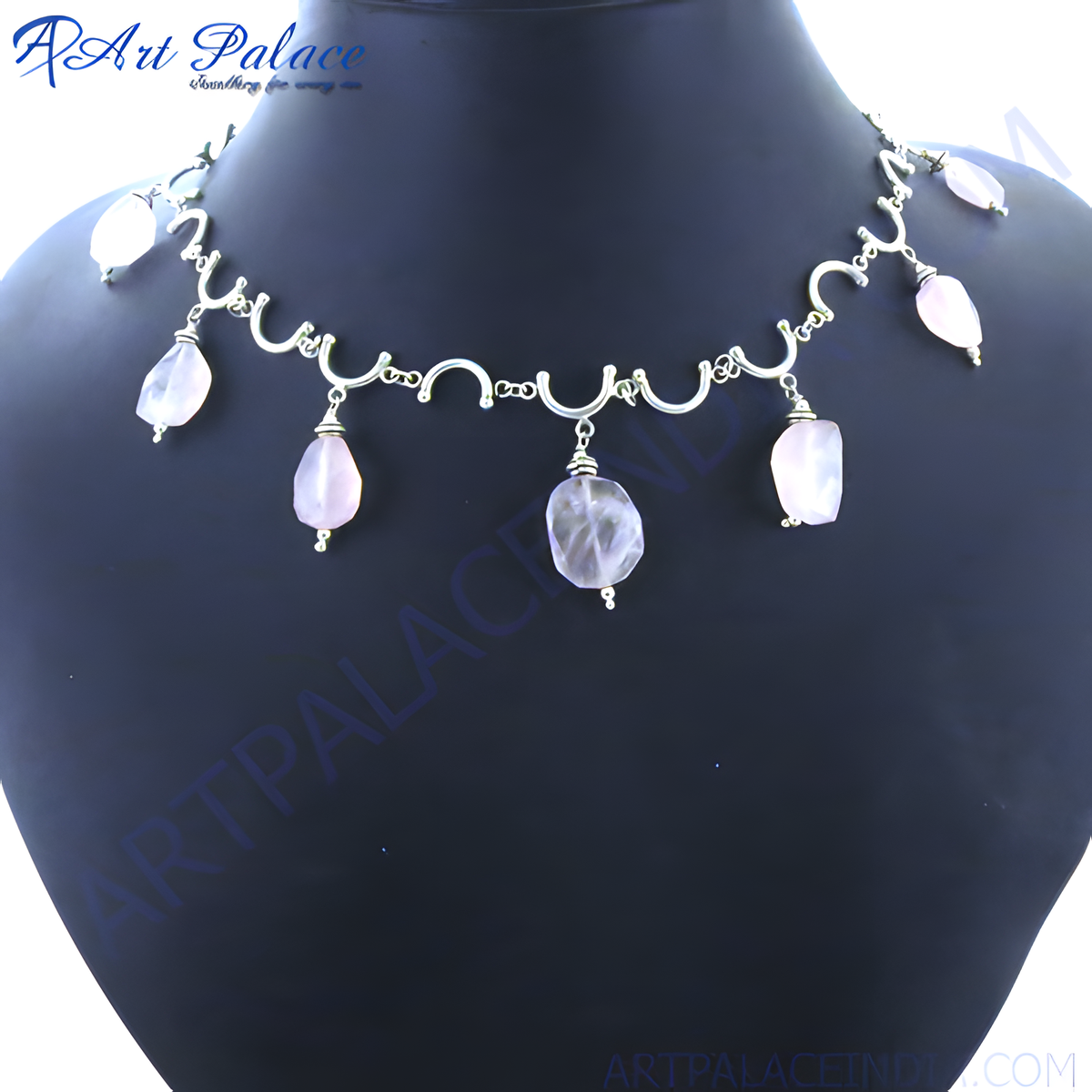 925 sterling silver necklace with dangling rose quartz gemstones on a black mannequin