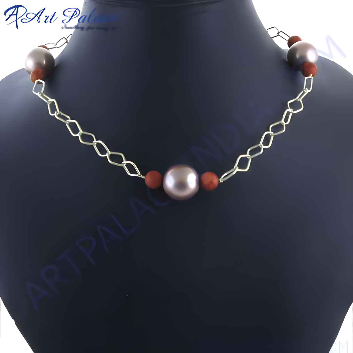 Pearl chain necklace with silver chain and brown beads on a black mannequin