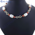 Load image into Gallery viewer, Beaded necklace featuring white beads and red beads connected by a gold chain, displayed on a black mannequin.
