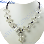 Load image into Gallery viewer, Quartz and iolite beaded necklace with clear and blue gemstones on a white mannequin
