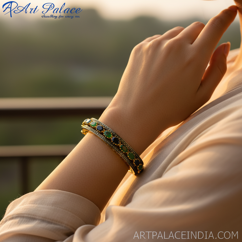 Gold bangle bracelet with emeralds and sapphires | luxury jewelry