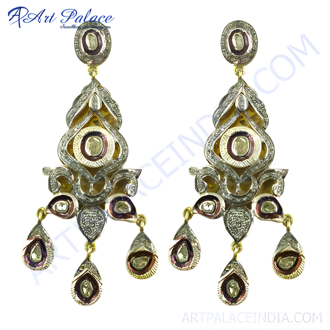 Gold and diamond dangle earrings featuring a unique design with intricate detailing and gemstone accents.