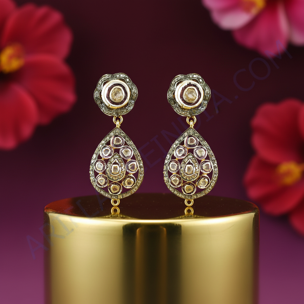 Gold teardrop earrings with diamonds | luxury jewelry