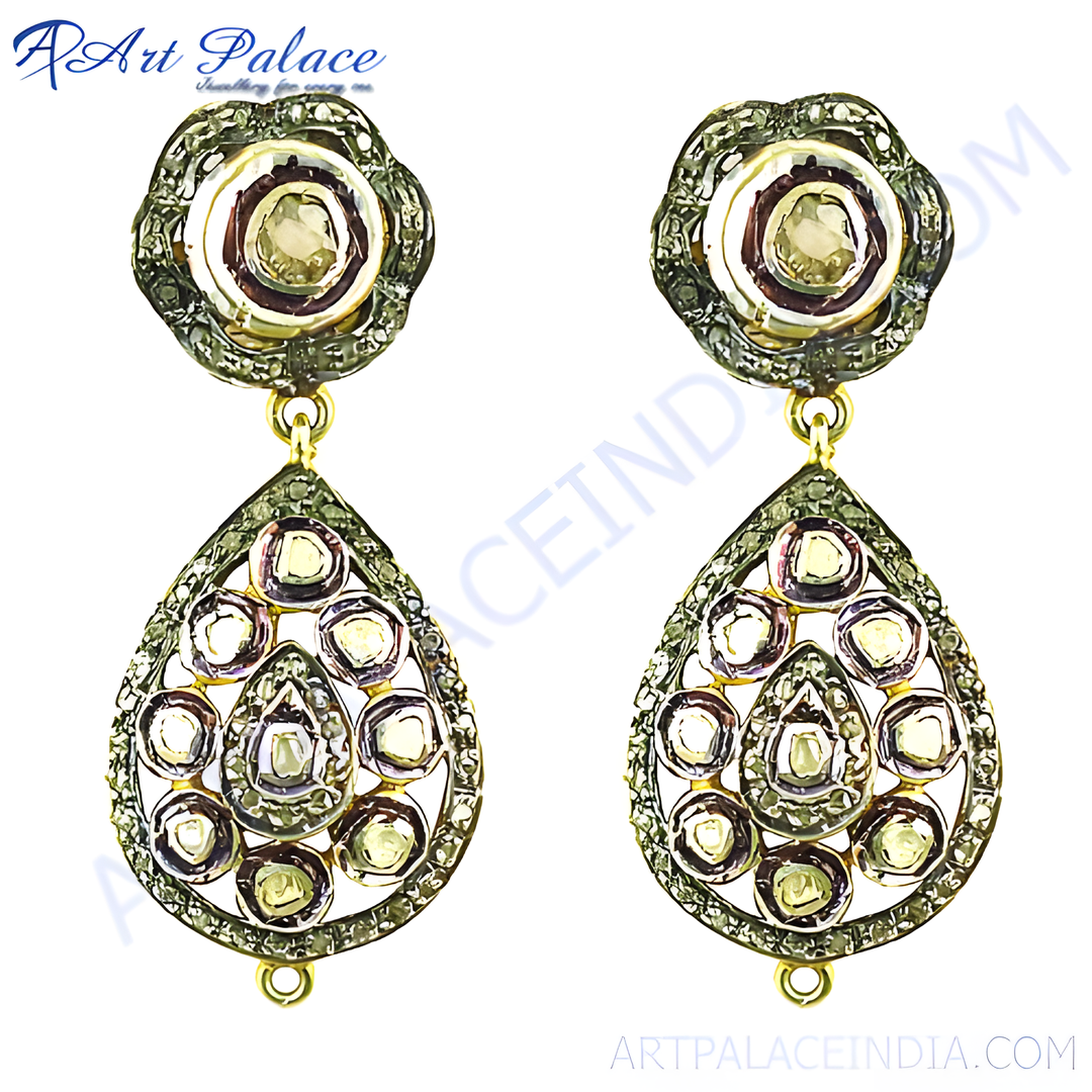 Gold teardrop dangle earrings with diamonds set in an ornate frame, a beautiful piece of luxury jewelry.