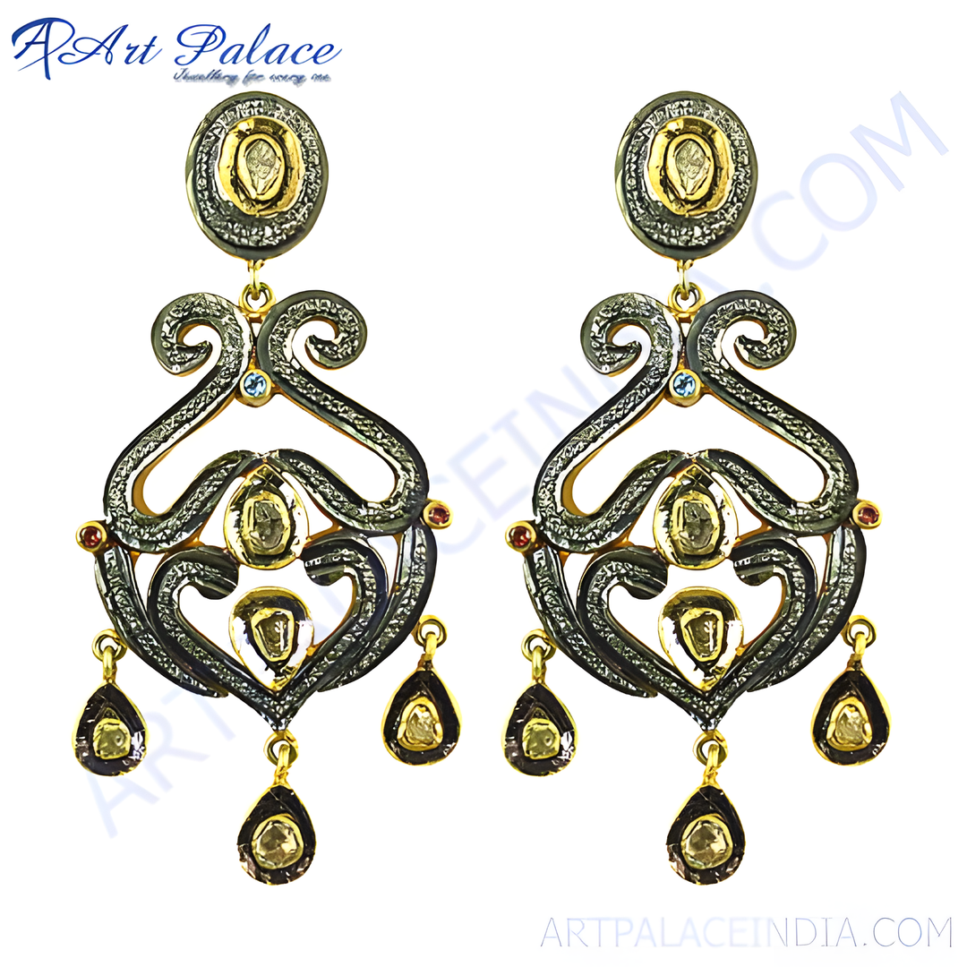 Gold and black diamond dangle earrings with intricate design and teardrop accents.