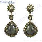 Load image into Gallery viewer, Gold dangle earrings with black stone, a stylish and elegant jewelry piece for women.
