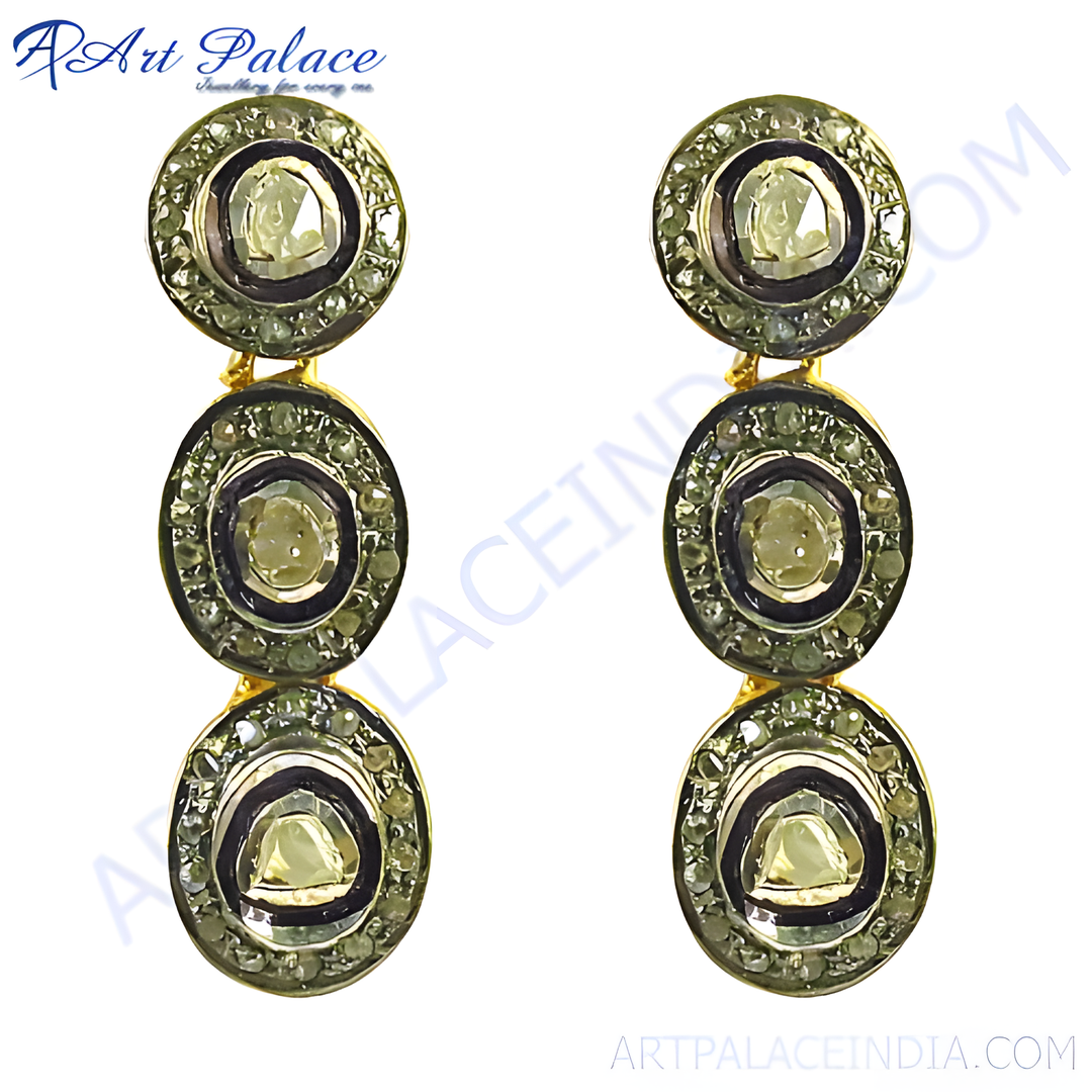 Gold polki diamond drop earrings with green and white gemstones.