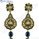 Load image into Gallery viewer, Gold-tone dangle earrings with white gemstone accents and a vibrant blue Lapis Lazuli gemstone drop.

